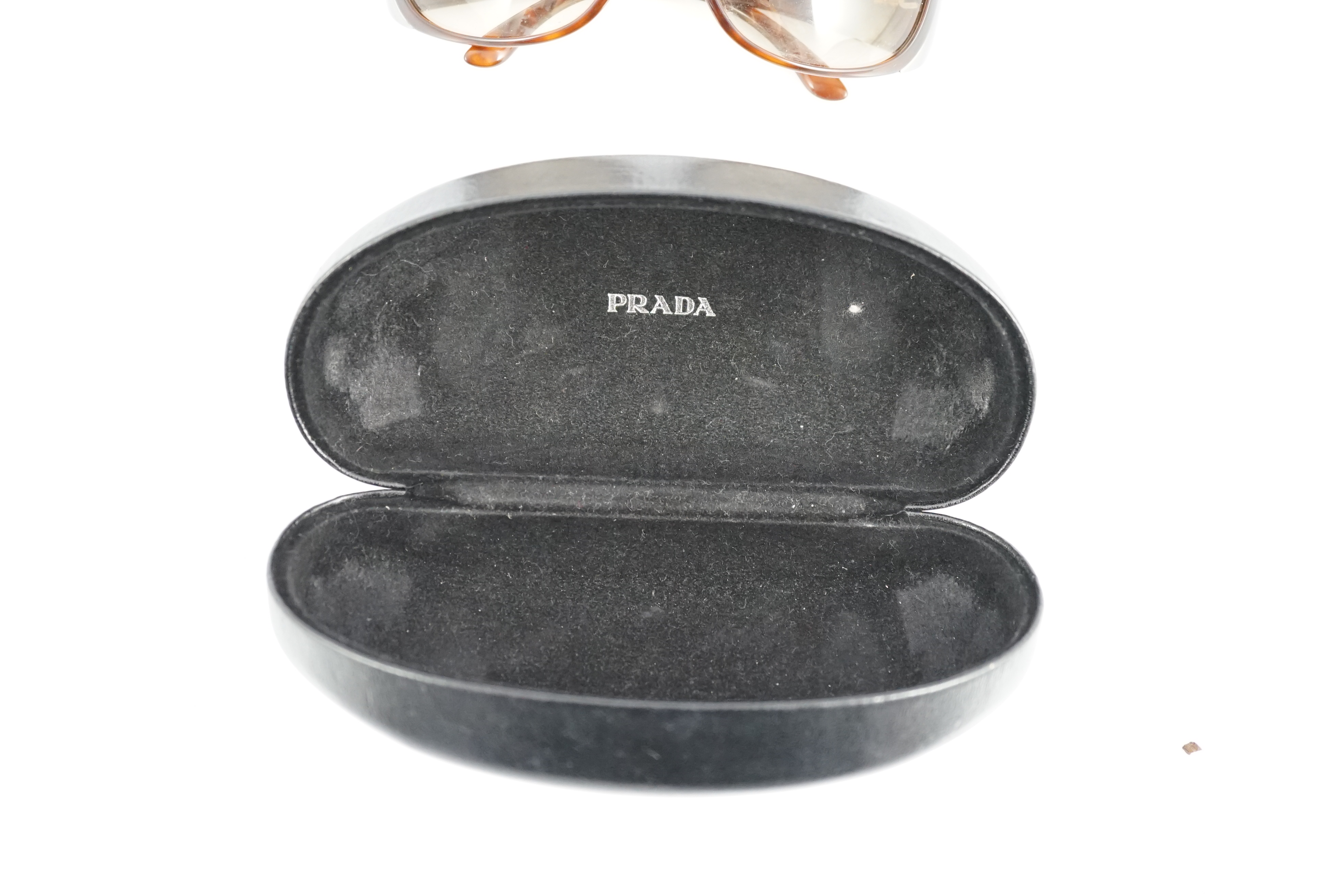 A pair of Prada tortoiseshell sunglasses